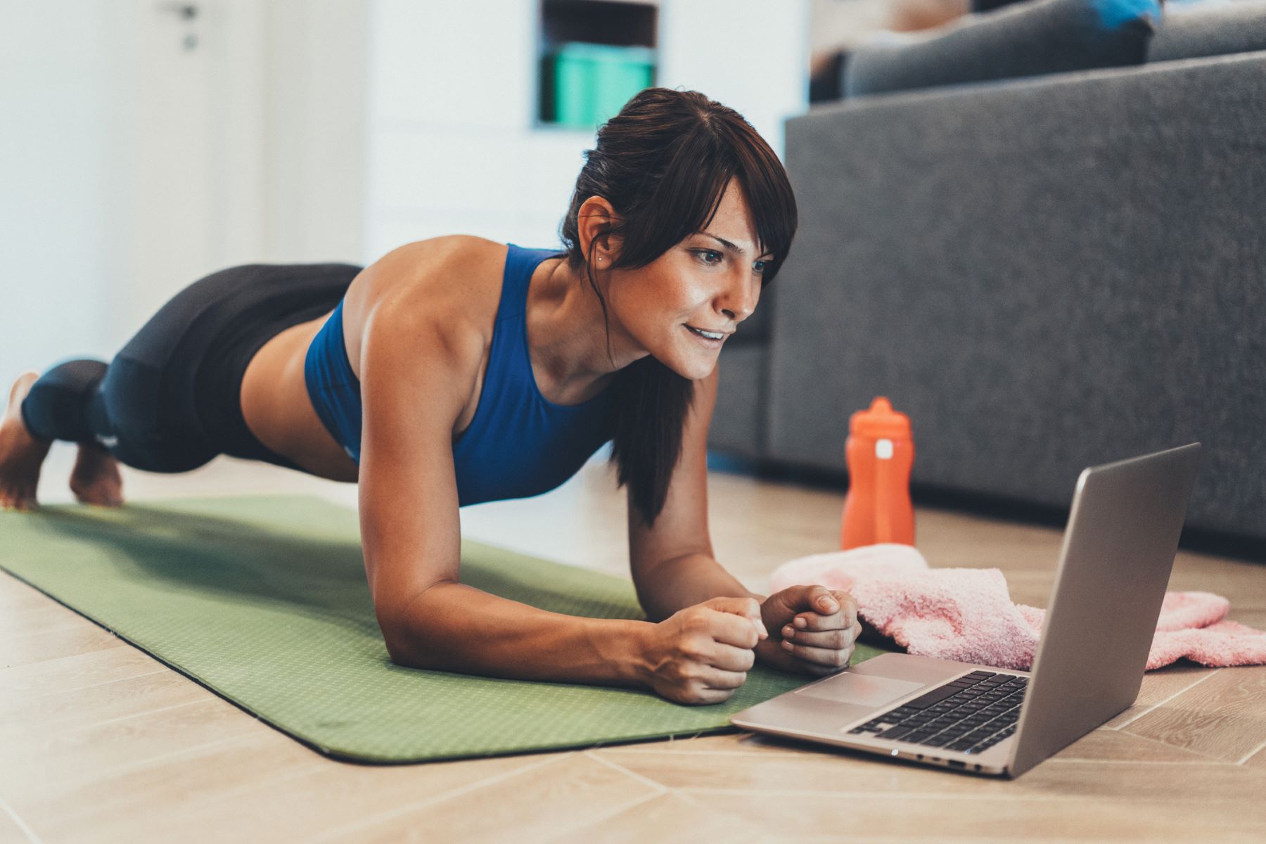 woman exercising with an online class