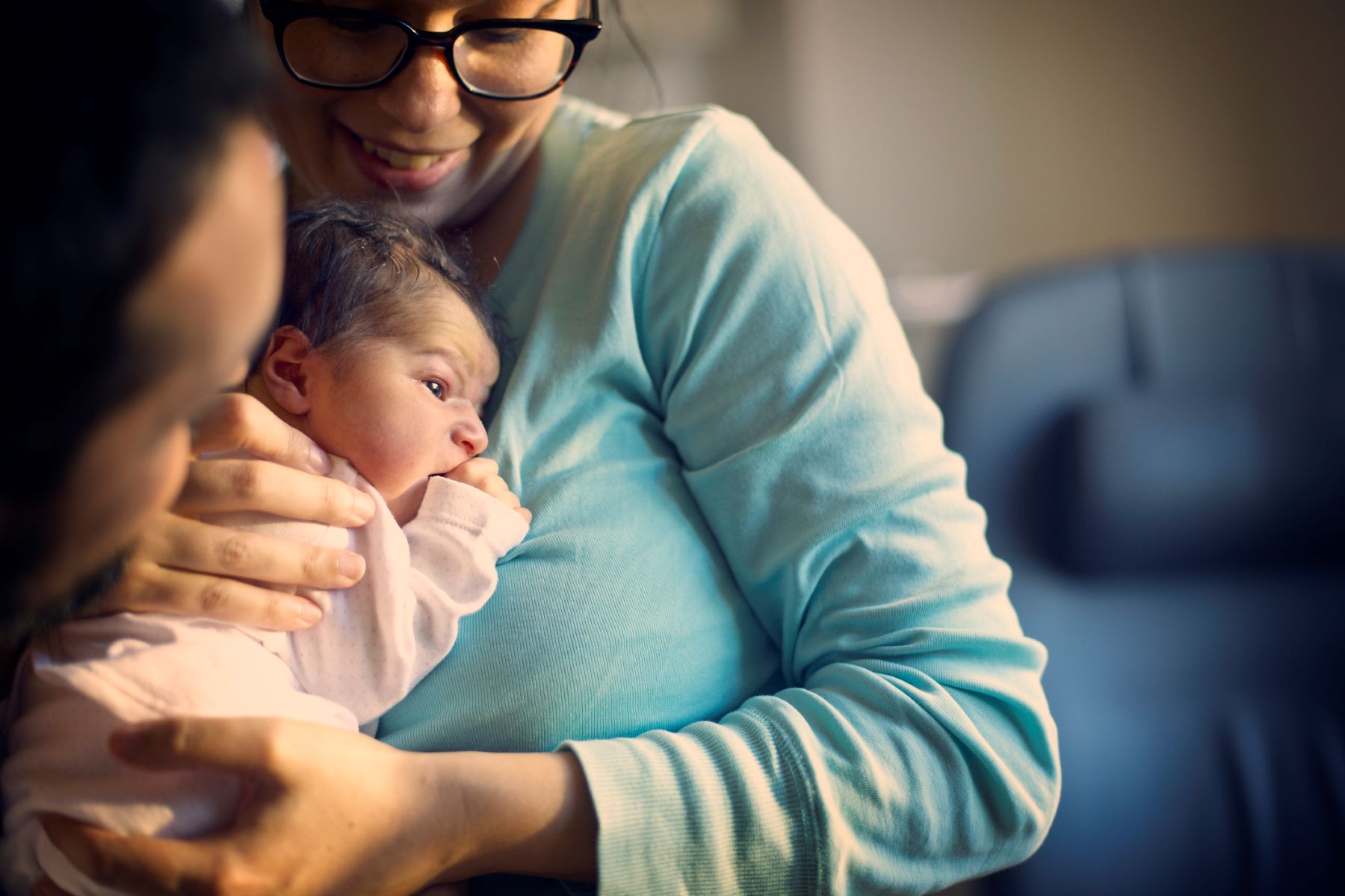 woman holding her newborn