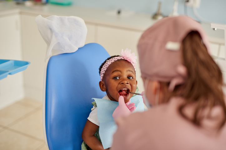 young girl getting her teeth checked