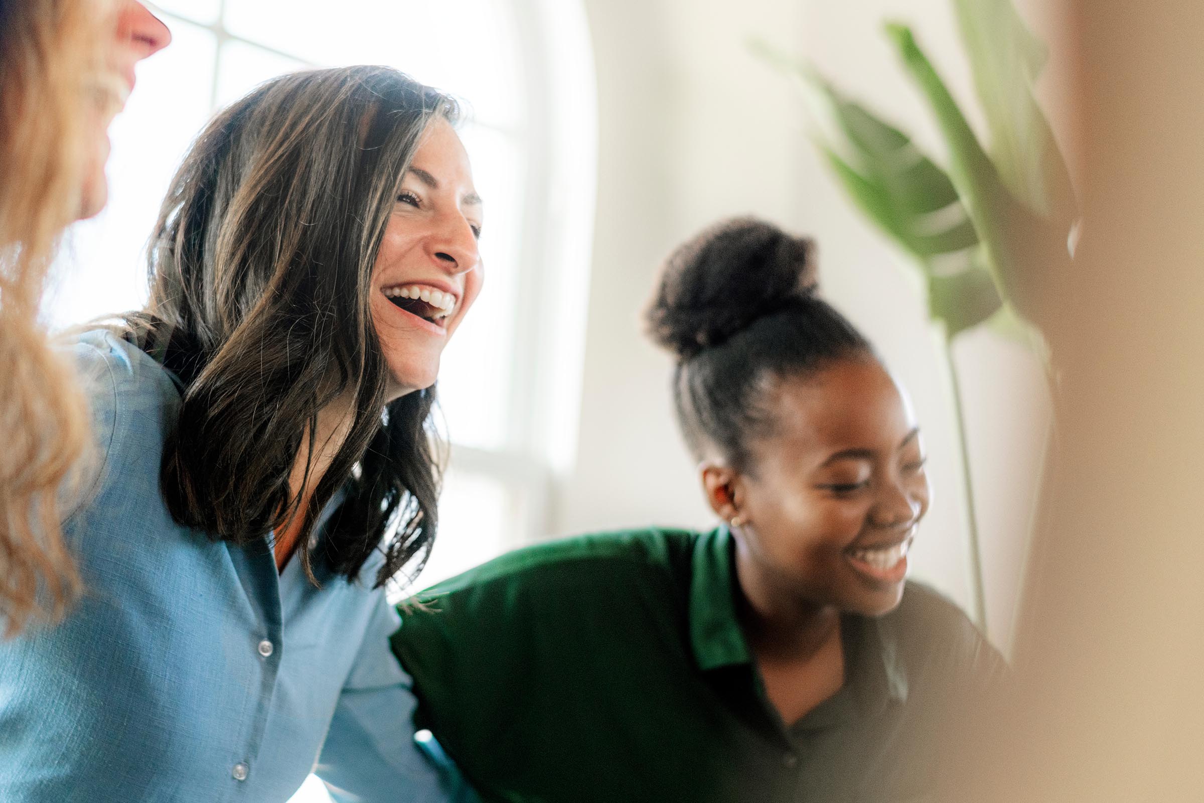 Woman and girl teenager laughing