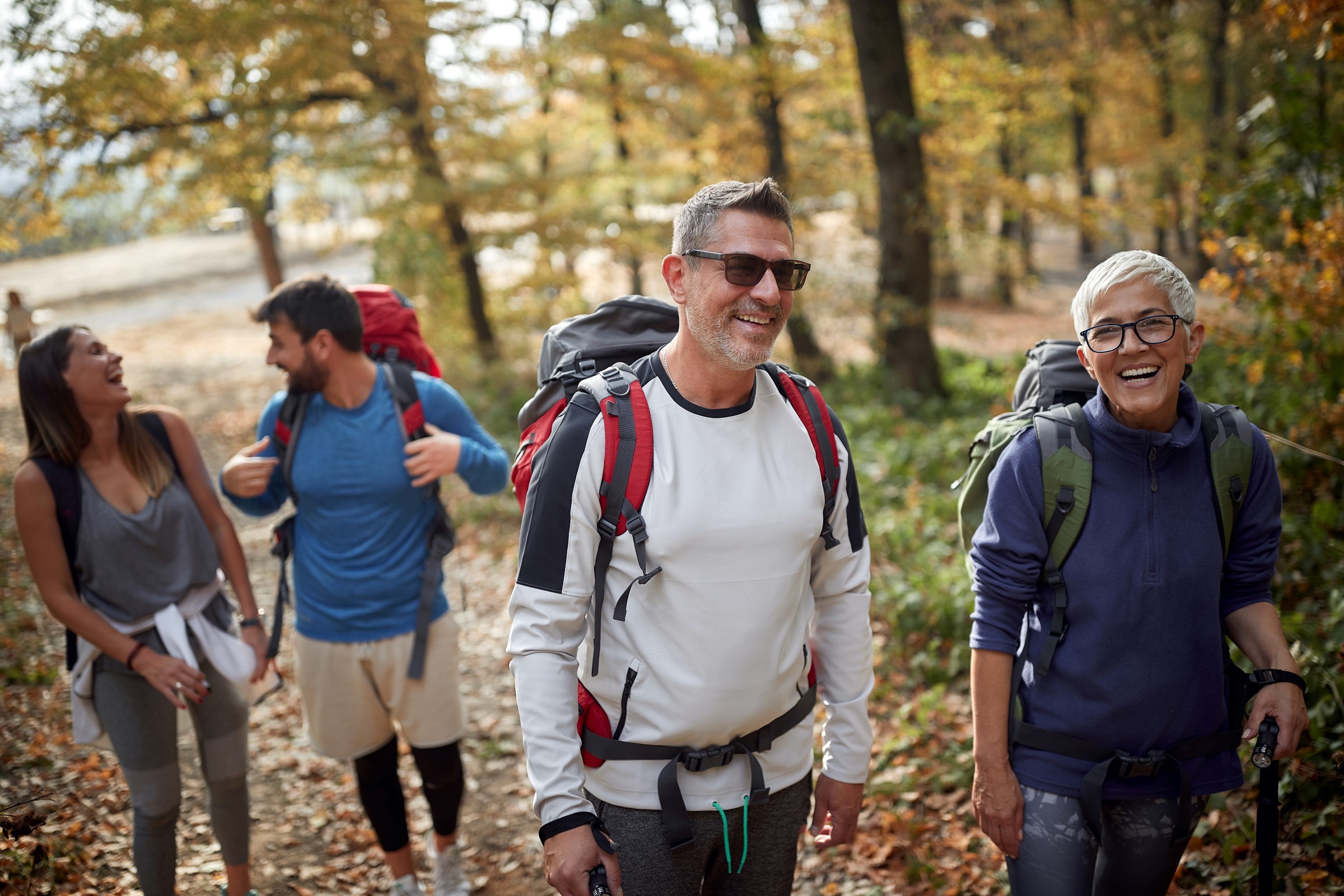 adult friends hiking in the woods