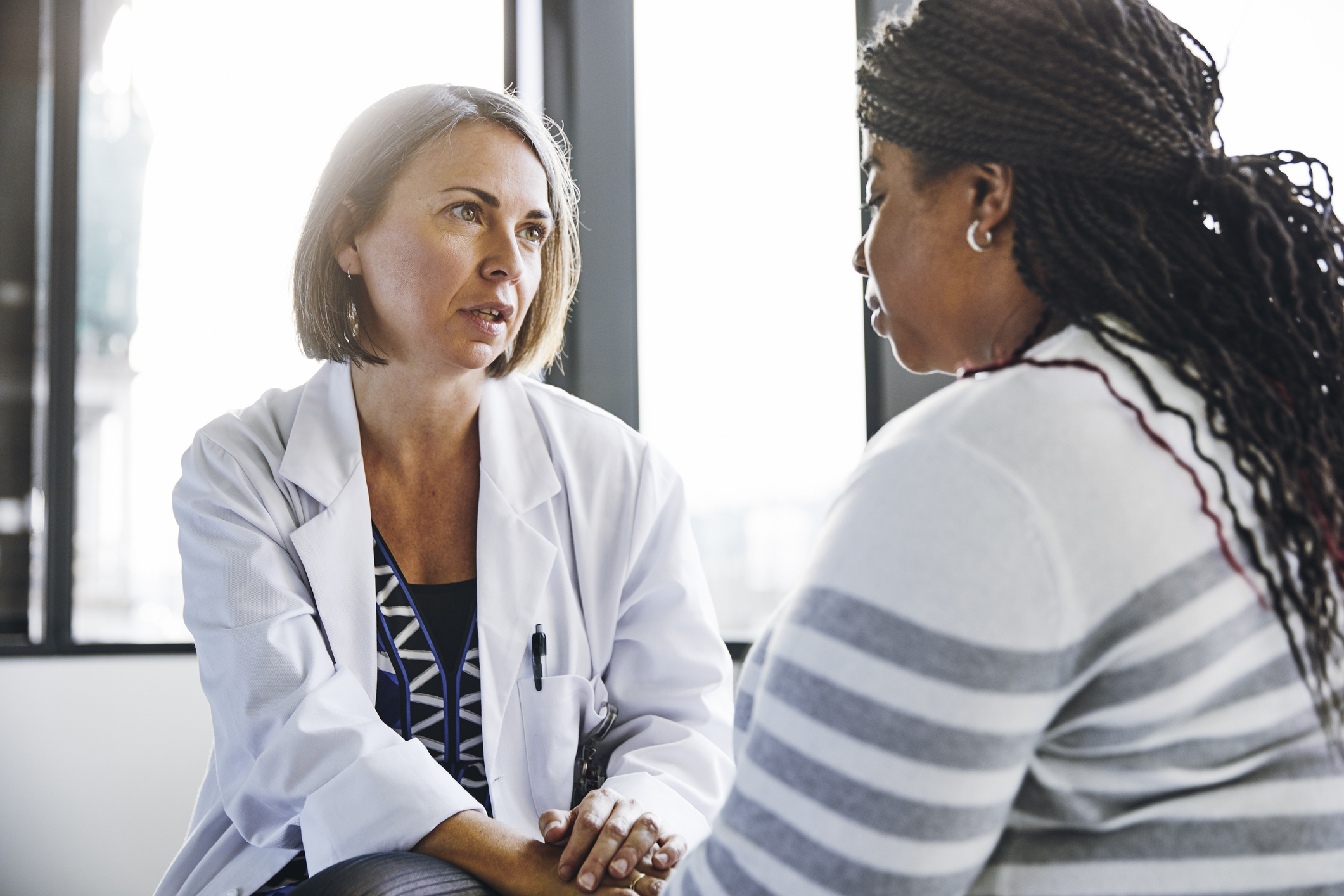 female doctor speaking to her female patient